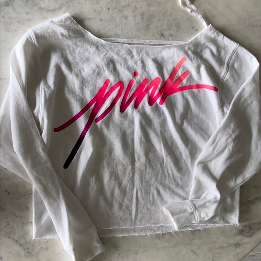 PINK sweatshirt with cutout details on back.